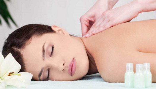 Woman on back massage in spa center